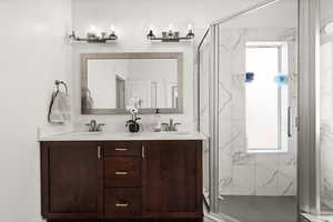 Bathroom with vanity and an enclosed shower