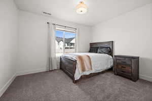 Bedroom featuring carpet flooring