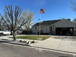 Ranch-style house featuring a garage