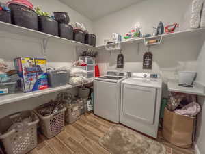 Clothes washing area featuring washing machine and dryer