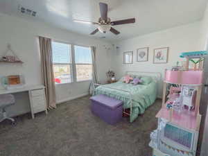 Carpeted bedroom with ceiling fan