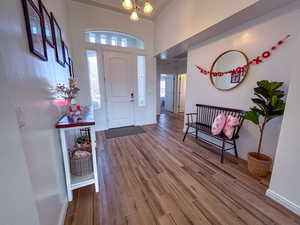 Foyer with hardwood / wood-style floors