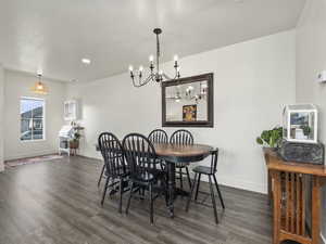 Dining space featuring dark hardwood / wood-style floors and a textured ceiling