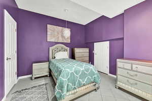 Bedroom featuring light tile patterned floors