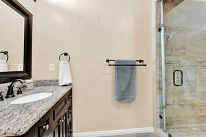 Bathroom with vanity and an enclosed shower