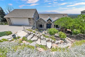 View of front of house featuring a garage and a mountain view