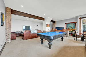 Rec room featuring beamed ceiling, light colored carpet, and pool table