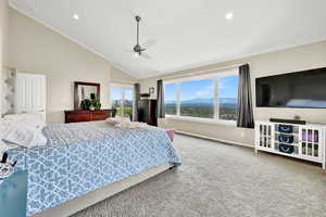 Bedroom featuring ornamental molding, carpet, high vaulted ceiling, and ceiling fan