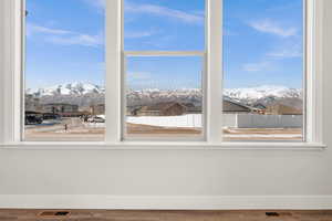 Interior space with a mountain view and hardwood / wood-style flooring