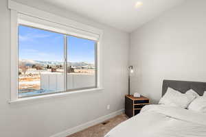 Bedroom with a mountain view and carpet flooring