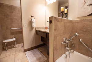 Bathroom with vanity and tile patterned flooring