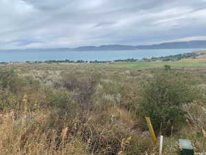 Exterior space with a rural view and a water view