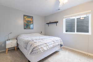 Bedroom featuring carpet floors and ceiling fan