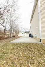 View of yard with a mountain view and a patio area