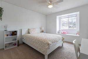 Bedroom featuring carpet flooring and ceiling fan