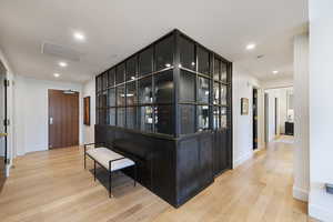 Bar featuring light hardwood / wood-style floors