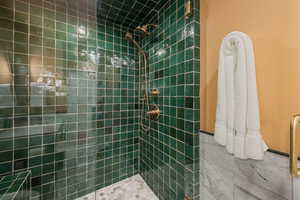 Bathroom featuring tiled shower