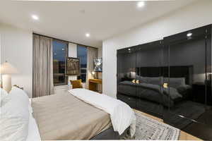 Bedroom featuring hardwood / wood-style floors and a closet