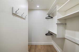 Walk in closet featuring hardwood / wood-style floors