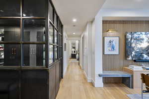 Corridor featuring light wood-type flooring