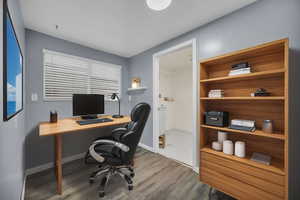 Office space outside of laundry area virtually staged.