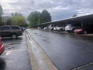 View of parking with a carport