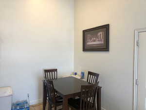 Dining space featuring light tile patterned floors