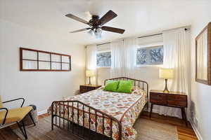 Bedroom featuring hardwood / wood-style flooring and ceiling fan