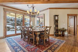 Dining room with an inviting chandelier and light wood-type flooring