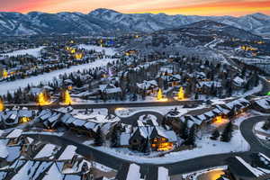 Snowy aerial view featuring a mountain view