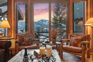 Living room with a mountain view and hardwood / wood-style floors