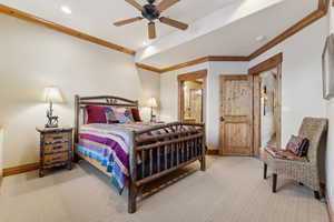 Bedroom featuring ornamental molding, light carpet, and ceiling fan