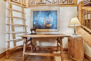 Sitting room with hardwood / wood-style flooring