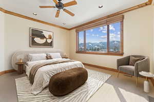 Bedroom featuring ornamental molding, carpet, recessed lighting, ceiling fan, and a mountain view