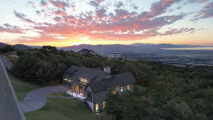 Aerial view at dusk featuring a mountain view