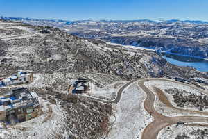 Snowy aerial view featuring a mountain view