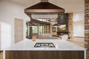 Kitchen with a fireplace, light hardwood / wood-style flooring, white gas stovetop, premium range hood, and a high ceiling