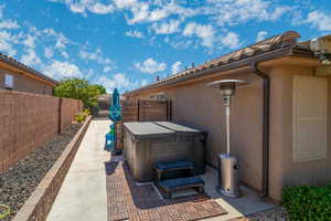 View of patio / terrace with a hot tub