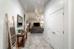 Hallway with light tile patterned floors