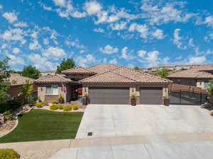 View of front facade with a garage and a front yard