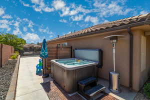 View of patio / terrace featuring a hot tub