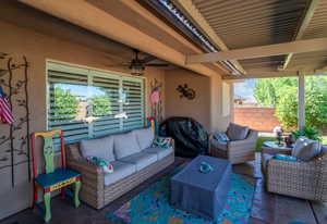 View of patio with ceiling fan, an outdoor hangout area, and area for grilling