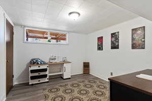 Home office featuring dark hardwood / wood-style floors