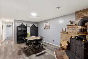 Dining space with hardwood / wood-style floors