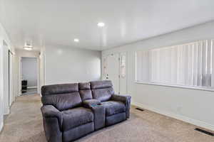 Living room with light colored carpet