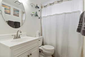 Bathroom featuring vanity and toilet