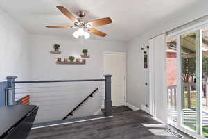 Staircase featuring hardwood / wood-style flooring and plenty of natural light