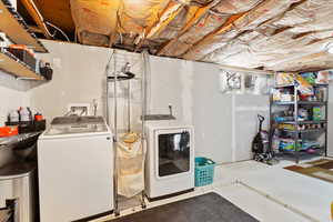 Laundry room featuring separate washer and dryer