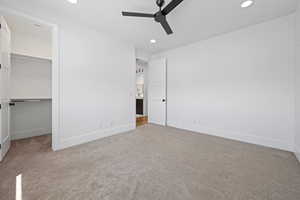 Unfurnished bedroom featuring carpet flooring, recessed lighting, and baseboards