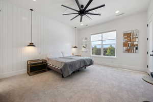 Bedroom featuring light carpet and ceiling fan